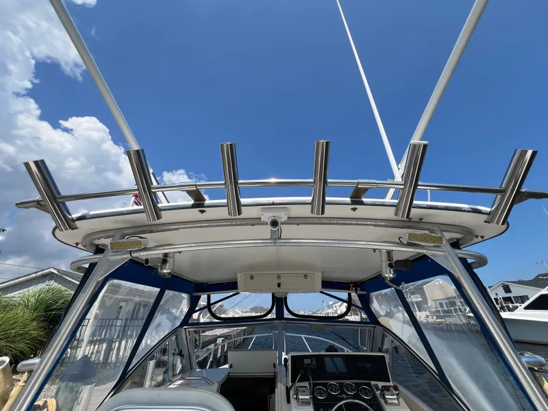 Slide: The Image of The image shows the cockpit of a 2002 Albemarle 280 Express Fisherman with a clear view of the helm. - 18