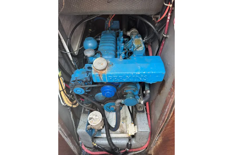 Slide: The Image of Blue Perkins engine in a 1980 Morgan 382 sailboat, showing detailed components and wiring. - 18
