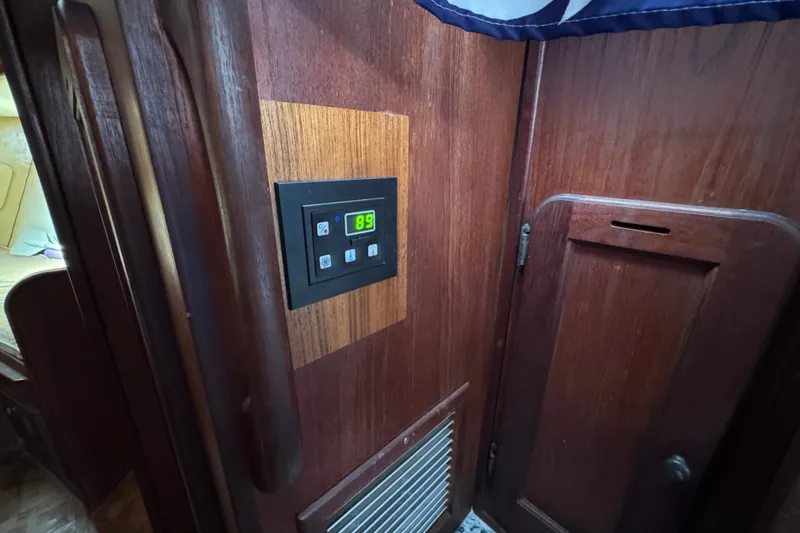 Slide: The Image of Control panel on wooden interior of 1980 Morgan 382 sailboat cabin. - 30