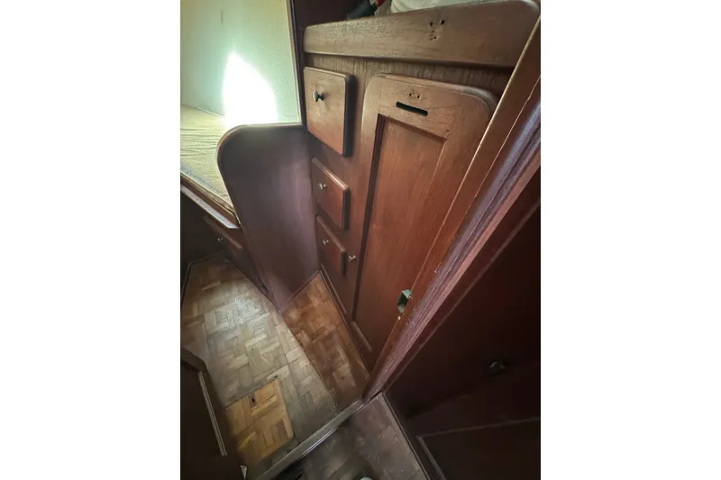 Slide: The Image of 1980 Morgan 382 interior with wooden cabinetry and parquet flooring. - 33