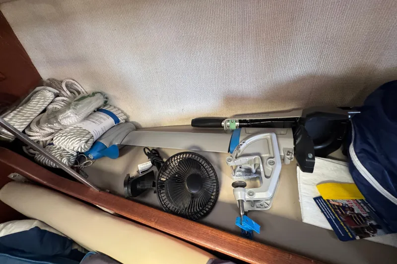 Slide: The Image of Storage area in a 1980 Morgan 382 sailboat with ropes, fan, and equipment. - 29