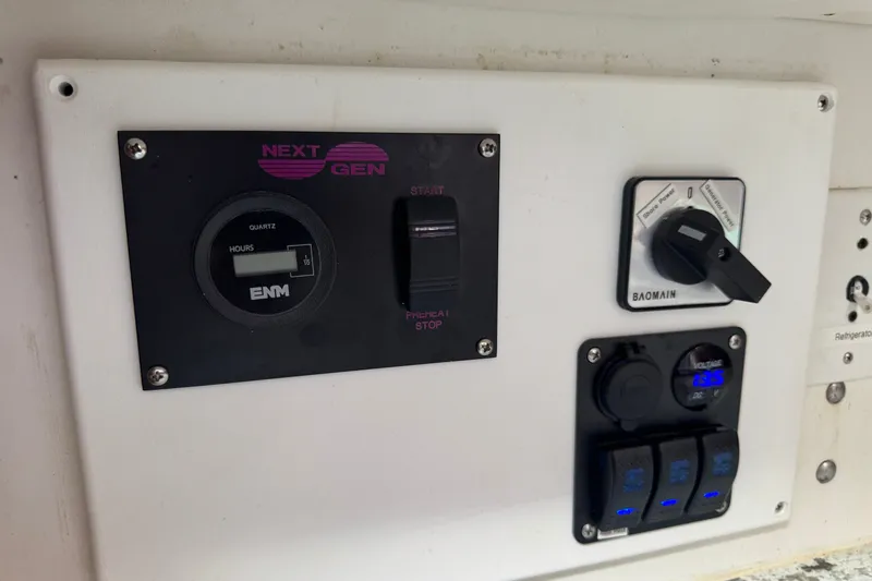 Slide: The Image of Control panel of a 1980 Morgan 382 sailboat with generator and power switches. - 15