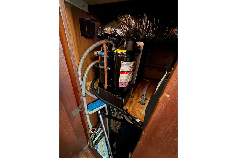 Slide: The Image of 1980 Morgan 382 boat interior showing mechanical components and wiring. - 34