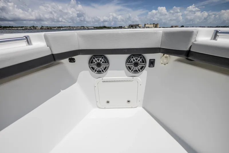 Slide: The Image of 2015 Yellowfin 39 Offshore boat interior with speakers and storage compartment. - 17