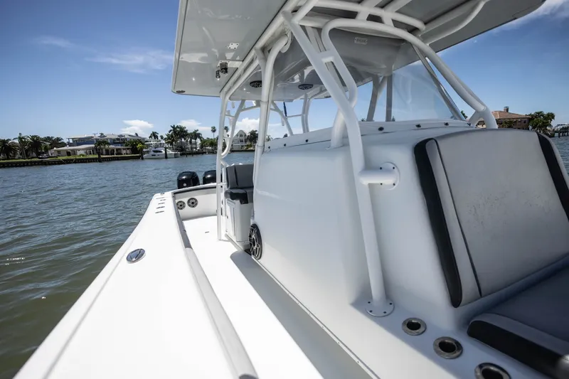 Slide: The Image of 2015 Yellowfin 39 Offshore boat on water, showcasing sleek design and spacious deck. - 20