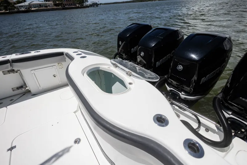 Slide: The Image of 2015 Yellowfin 39 Offshore boat with powerful Mercury outboard engines on a calm waterway. - 26