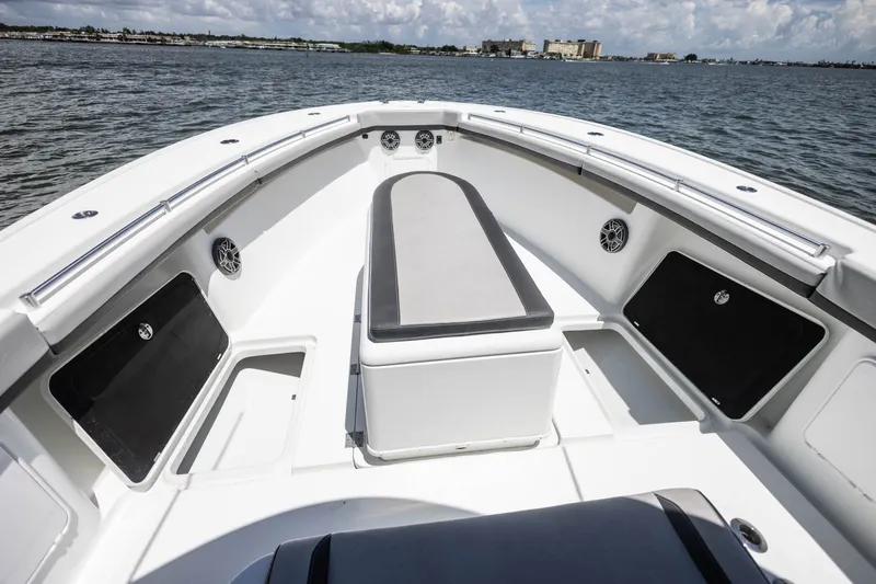 Slide: The Image of 2015 Yellowfin 39 Offshore boat interior with seating and storage compartments. - 13