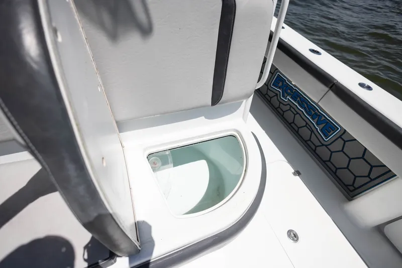 Slide: The Image of 2015 Yellowfin 39 Offshore boat interior with seating and storage compartment. - 25