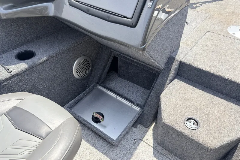 Slide: The Image of Interior of 2020 Tracker Pro Guide V-165 WT boat, featuring seating and storage compartments. - 20