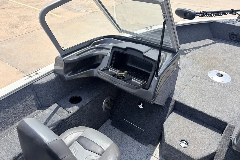 Slide: The Image of 2020 Tracker Pro Guide V-165 WT boat interior with seating and storage compartments. - 19
