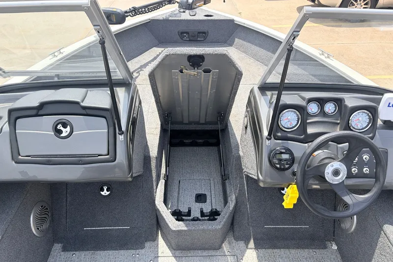 Slide: The Image of 2020 Tracker Pro Guide V-165 WT boat interior with steering wheel and dashboard controls. - 16