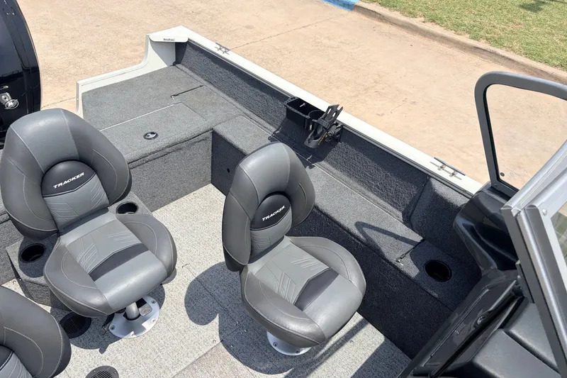 Slide: The Image of 2020 Tracker Pro Guide V-165 WT boat interior with gray seating and storage compartments. - 21