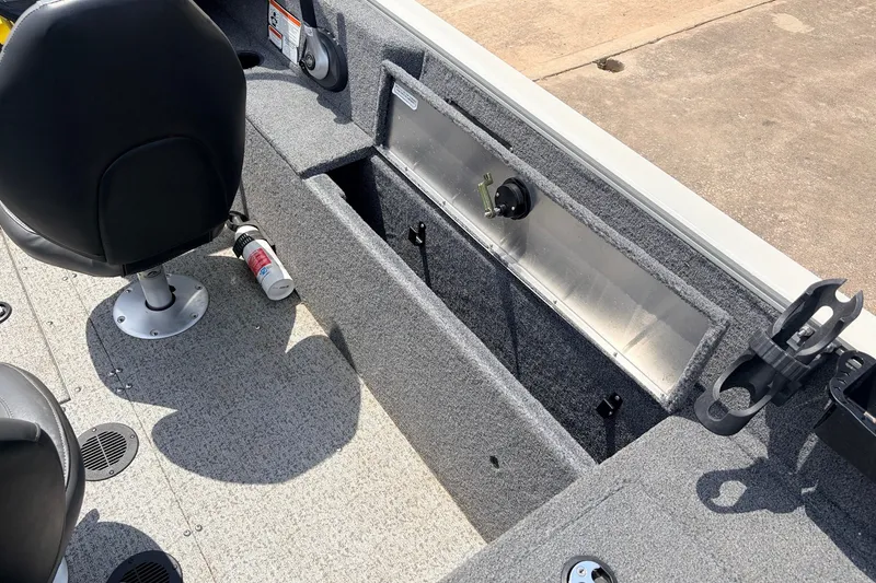 Slide: The Image of 2020 Tracker Pro Guide V-165 WT boat interior with seating and storage compartments. - 30