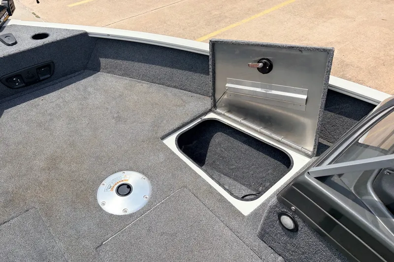 Slide: The Image of 2020 Tracker Pro Guide V-165 WT boat interior with open storage compartment. - 15