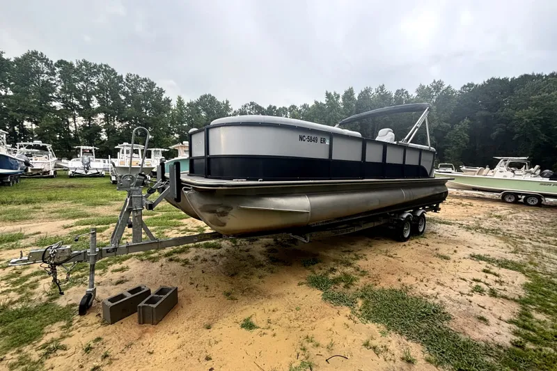 Slide: The Image of 2021 Bentley Pontoons 243 Navigator on trailer in outdoor setting. - 14
