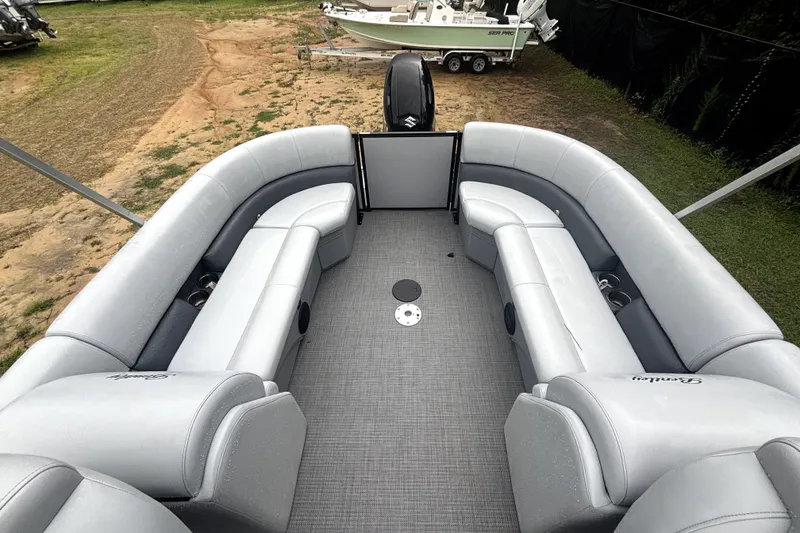 Slide: The Image of The image shows the interior of a 2021 Bentley Pontoons 243 Navigator with gray seating. - 3
