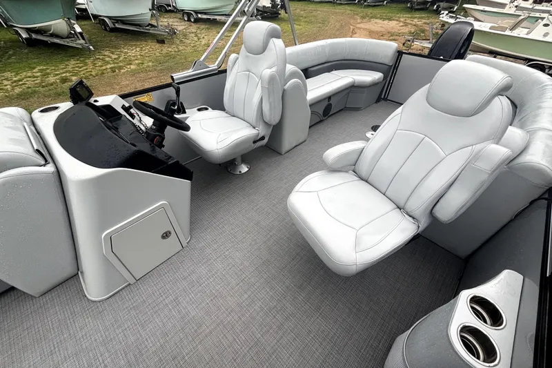 Slide: The Image of 2021 Bentley Pontoons 243 Navigator interior with plush seating and modern helm design. - 7