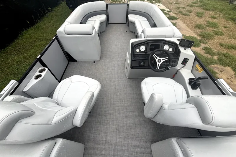 Slide: The Image of 2021 Bentley Pontoons 243 Navigator interior with plush seating and modern helm. - 9