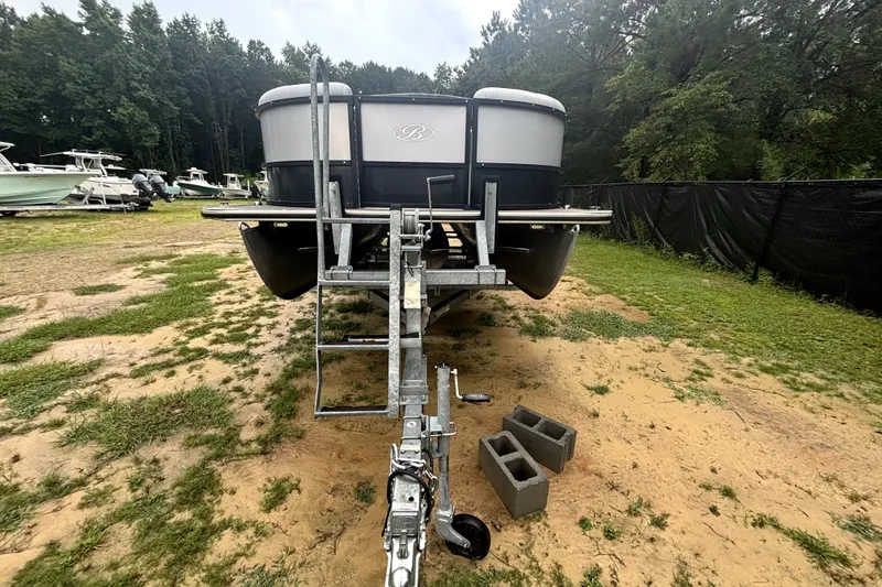 Slide: The Image of 2021 Bentley Pontoons 243 Navigator on trailer in outdoor setting. - 13