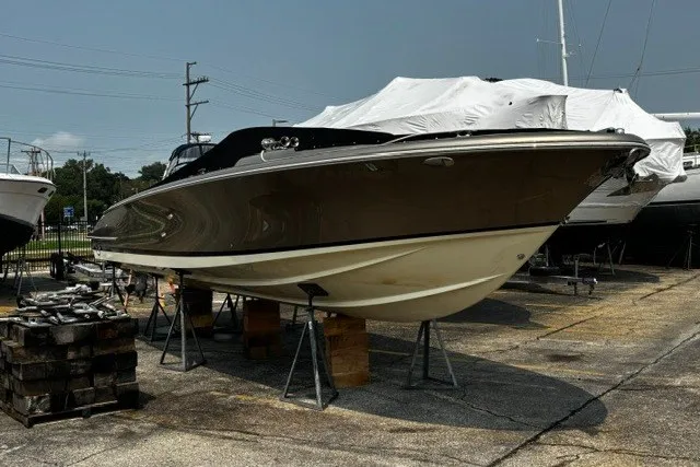 Slide: The Image of 2014 Chris-Craft Launch 32 boat on stands in a marina setting. - 20