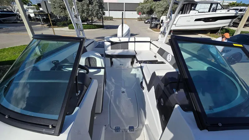 Slide: The Image of 2023 Monterey M225 boat interior with open cockpit and seating area. - 10