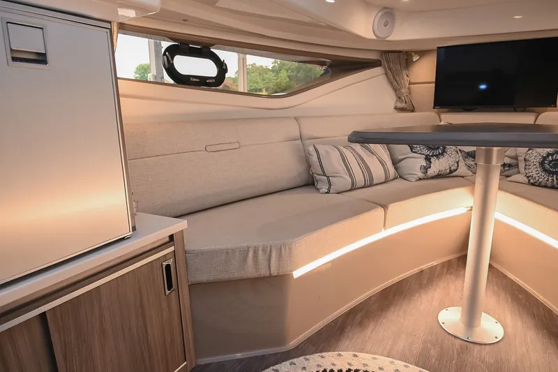 Slide: The Image of Luxurious interior of 2024 Sea Ray Sundancer 320 yacht with cozy seating and modern amenities. - 56