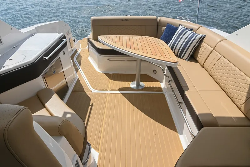 Slide: The Image of Luxurious 2024 Sea Ray Sundancer 320 boat interior with elegant seating and table. - 18