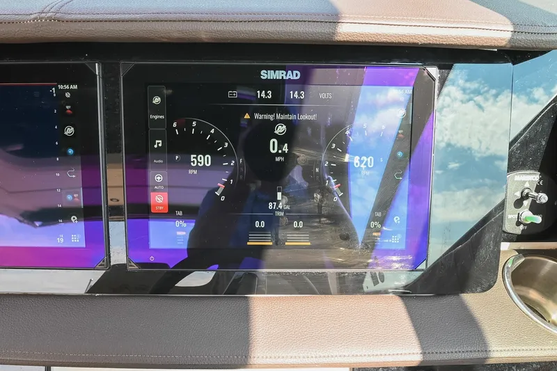 Slide: The Image of Simrad display on 2024 Sea Ray Sundancer 320 showing engine RPM and voltage. - 46