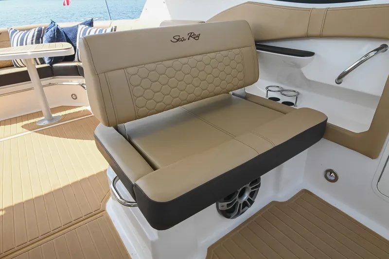 Slide: The Image of 2024 Sea Ray Sundancer 320 interior with tan seating and elegant design. - 19