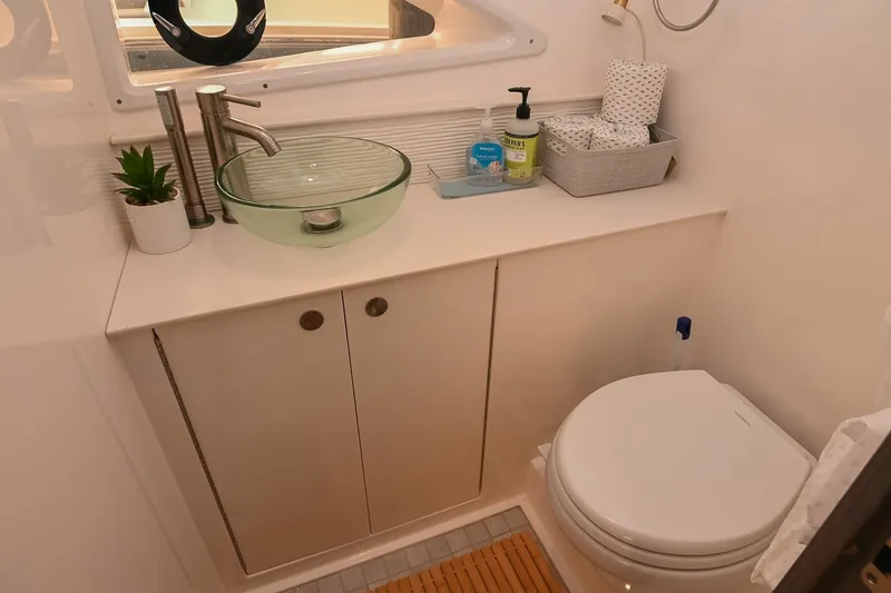 Slide: The Image of Luxurious bathroom in 2024 Sea Ray Sundancer 320 yacht with modern fixtures and amenities. - 72