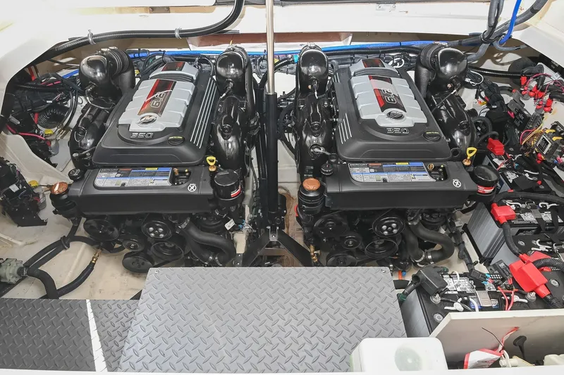 Slide: The Image of Engine compartment of 2024 Sea Ray Sundancer 320 with dual 350 horsepower engines. - 63