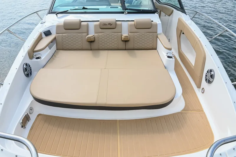 Slide: The Image of Luxurious 2024 Sea Ray Sundancer 320 boat interior with beige seating and elegant design. - 25
