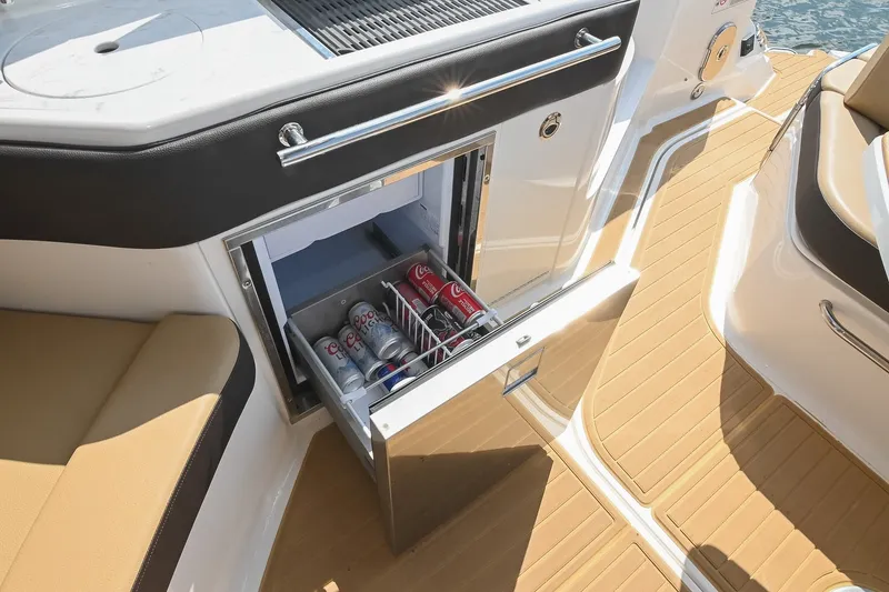 Slide: The Image of Built-in cooler on 2024 Sea Ray Sundancer 320 yacht, stocked with beverages. - 42