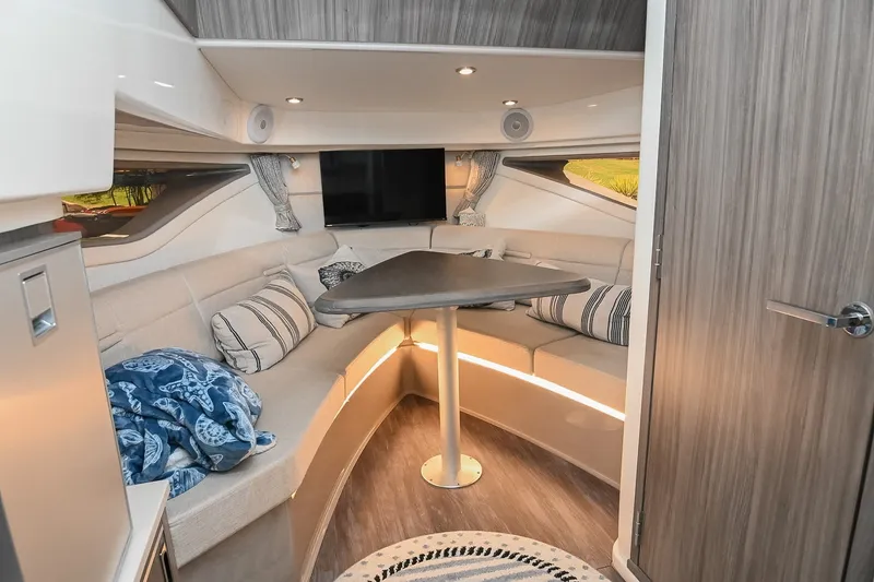 Slide: The Image of Luxurious interior of 2024 Sea Ray Sundancer 320 yacht with cozy seating and modern decor. - 55