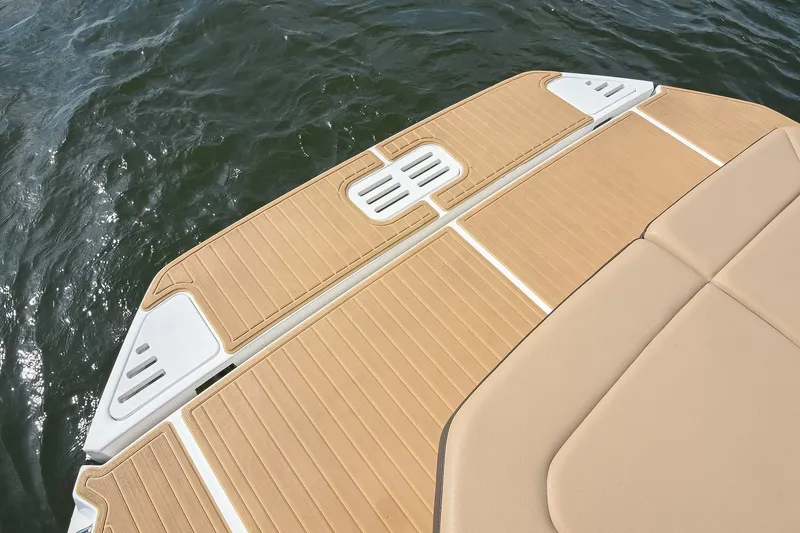 Slide: The Image of 2024 Sea Ray Sundancer 320 swim platform with tan decking, overlooking water. - 51