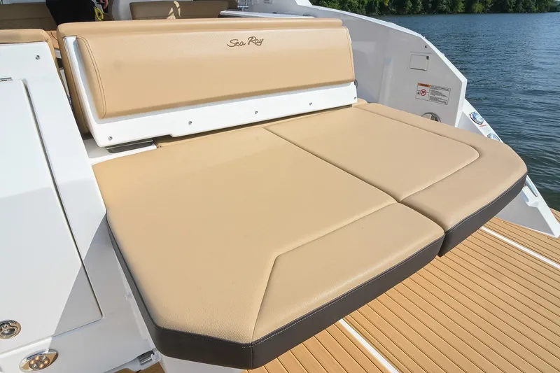 Slide: The Image of 2024 Sea Ray Sundancer 320, featuring a luxurious tan sunpad on the deck. - 29