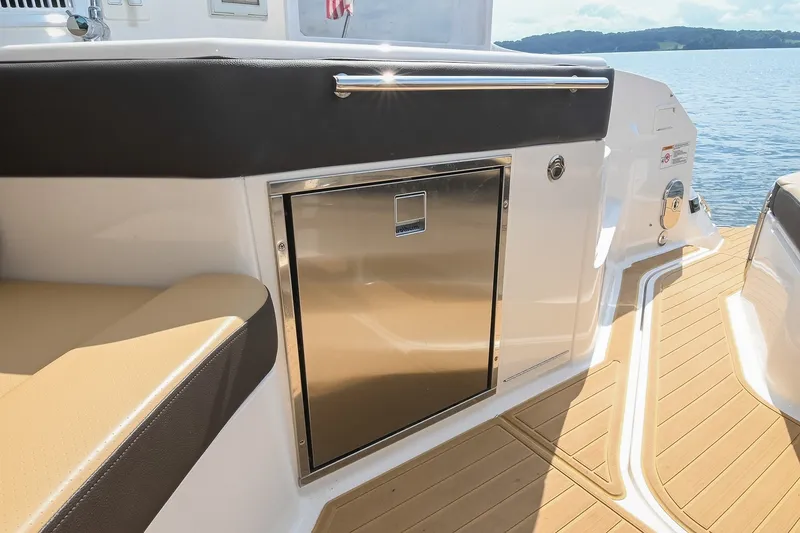 Slide: The Image of 2024 Sea Ray Sundancer 320 boat interior with stainless steel cabinet and teak flooring. - 41
