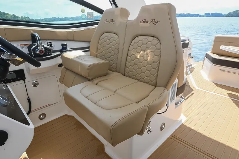 Slide: The Image of Luxurious 2024 Sea Ray Sundancer 320 cockpit with plush seating and modern controls. - 34
