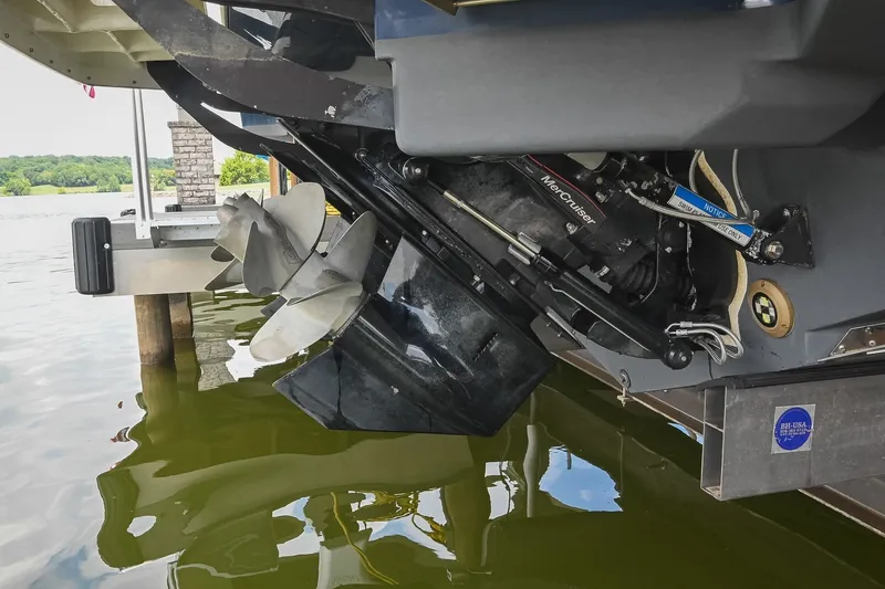 Slide: The Image of 2024 Sea Ray Sundancer 320 boat engine and propeller in water, showcasing MerCruiser components. - 81