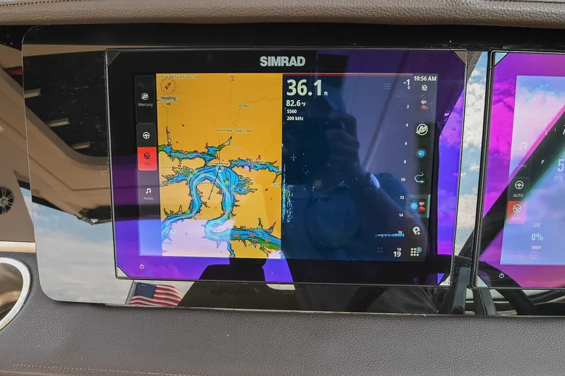Slide: The Image of Simrad navigation display on 2024 Sea Ray Sundancer 320 boat dashboard. - 45