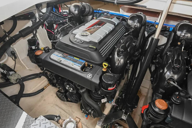 Slide: The Image of Engine compartment of 2024 Sea Ray Sundancer 320, featuring a powerful 350 engine. - 73