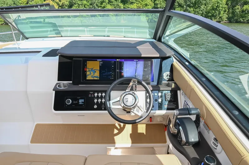 Slide: The Image of 2024 Sea Ray Sundancer 320 helm with modern navigation system and luxurious interior design. - 33