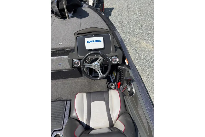 Slide: The Image of 2022 Ranger Z518 boat cockpit with Lowrance display and steering wheel. - 13