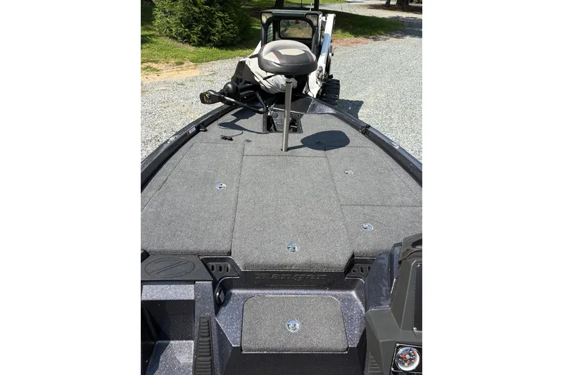 Slide: The Image of 2022 Ranger Z518 boat deck with seating and storage compartments. - 8