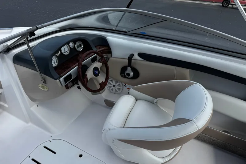 Slide: The Image of Interior view of 2006 Four Winns 200 Horizon boat cockpit with steering wheel and gauges. - 25