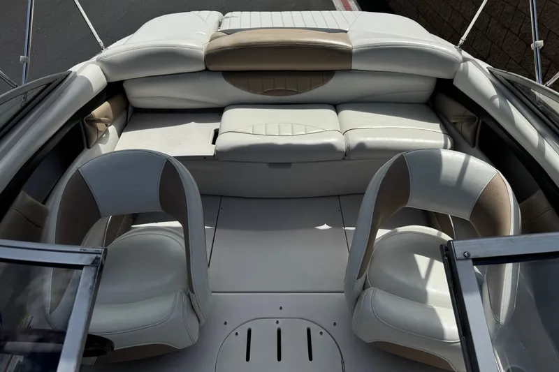 Slide: The Image of Interior of 2006 Four Winns 200 Horizon boat with white and beige seating. - 13