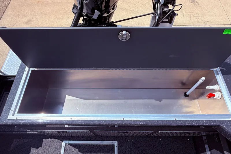 Slide: The Image of Open storage compartment in 2026 Lund 210 Heavy Gauge boat, showcasing interior features. - 33