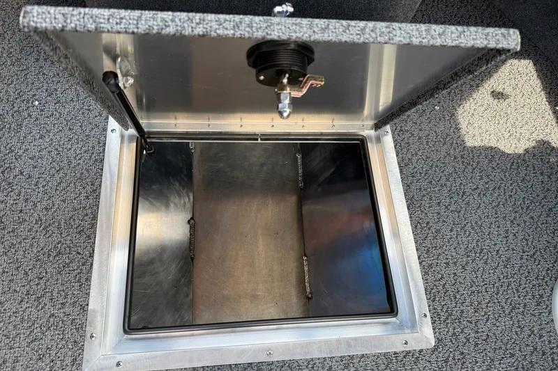 Slide: The Image of Open storage compartment in 2026 Lund 210 Heavy Gauge boat, featuring durable construction. - 23
