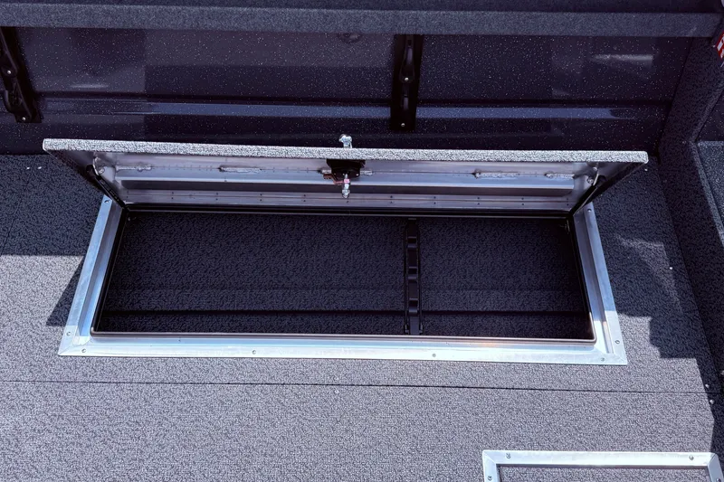 Slide: The Image of Open storage compartment in 2026 Lund 210 Heavy Gauge boat, showcasing interior space. - 36