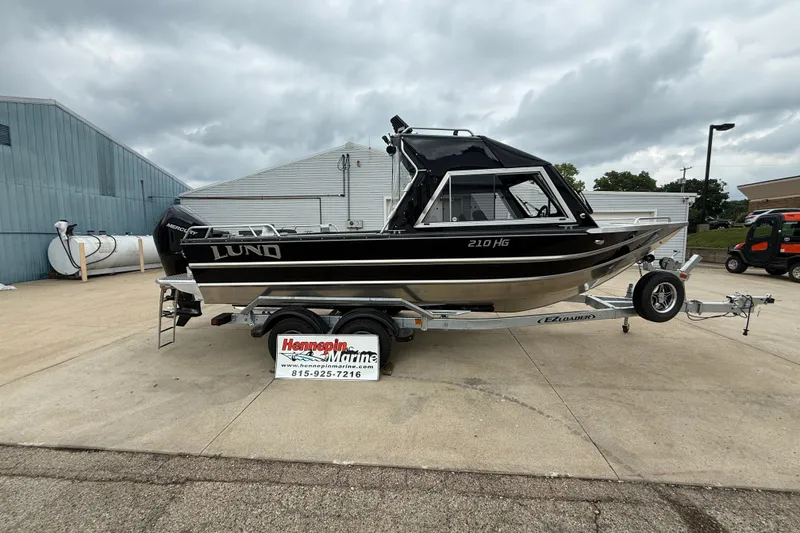 The Image of 2026 Lund 210 Heavy Gauge boat on trailer at Hennepin Marine dealership. - 0